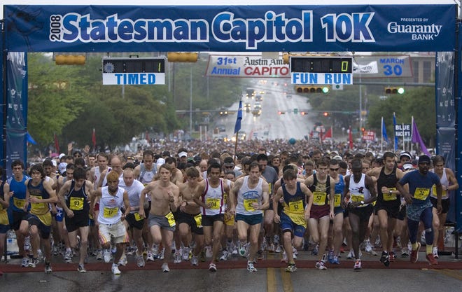 The timed runners start the Statesman Capitol 10,000 on Sunday March 30, 2008. [Jay Janner/American-Statesman]