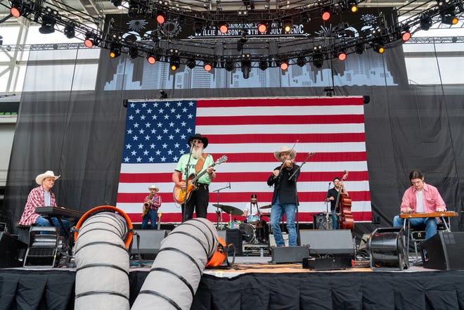 Ray Benson (C) of Asleep at the Wheel performs in concert during Willie Nelson's 4th of July Picnic at Q2 Stadium on July 04, 2023 in Austin, Texas.